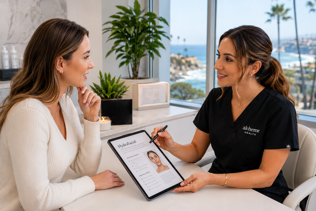 Client discussing customized HydraFacial treatment options with a skincare professional in La Jolla CA.
